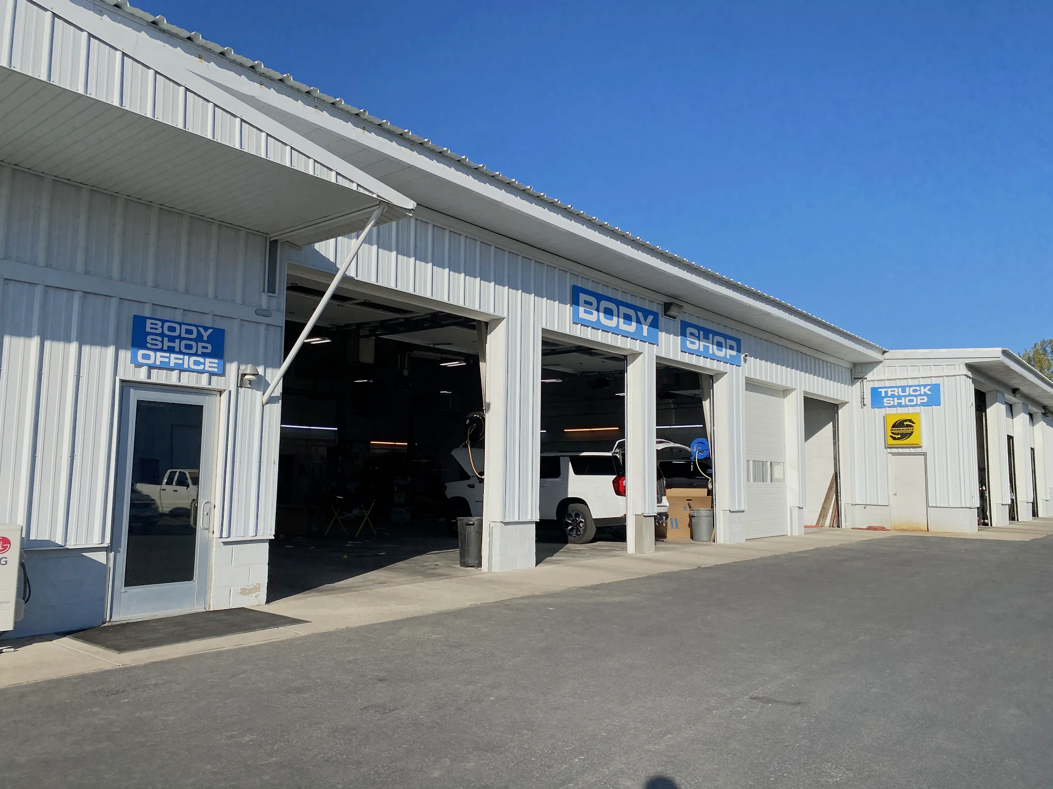 Body Shop Office entrance and repair bays at Taylor Body Shop, around back of Taylor Chevrolet